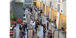 Researchers present and discuss their work in the atrium of Duffield Hall at Cornell University.
