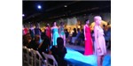 Models show off the latest fashions to raise money to sequence the genome of the Puerto Rican parrot.