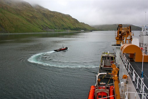 On June 25, 2011, a tug boat headed back to Dutch Harbor, Alaska, after guiding the U.S. Coast Guard Cutter Healy away from port as part of the ICESCAPE mission, or "Impacts of Climate on Ecosystems and Chemistry of the Arctic Pacific Environment."