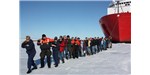 On July 13, 2011, scientists and crew of the Healy lined up for a rare photo op to "tow" the icebreaker ship through sea ice in the Arctic Ocean, led by Captain Beverly Havlik. 