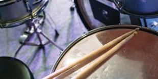 Rhythm Arises from Random Beats in a “Telephone” Game