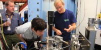 Bill Sellers (left), Holly Barden (center) and Uwe Bergmann (right), align the apparatus in order to get an accurate reading.