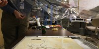 Author of the paper, Bill Sellers places a helium bag seal on Archaeopteryx fossil before scanning it on the synchrotron.