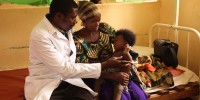 Dr Lusingu attending to children with malaria in the pediatric ward of the Korogwe District Hospital in Tanzania.