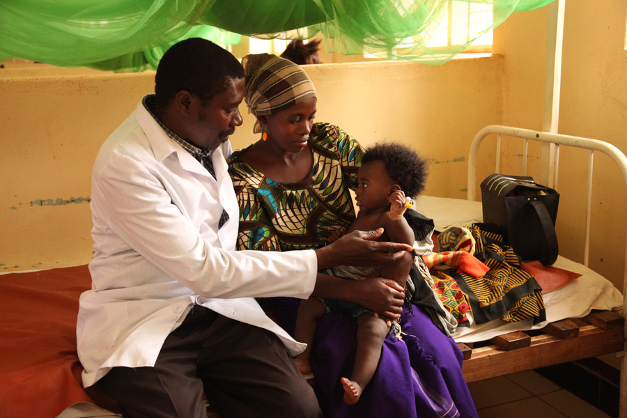 Dr Lusingu attending to children with malaria in the pediatric ward of the Korogwe District Hospital in Tanzania.
