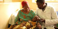 Dr. Lusingu attending to children with malaria in the pediatric ward of the Korogwe District Hospital in Tanzania.