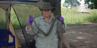 Reeder holding a highly poisonous black mamba snake killed by the nightwatchman she had hired to protect the family compound from both human and animal intruders. The nightwatchman would sleep in a tent in the middle of the compound with a machete and a bow and arrow at arm's reach.Courtesy of DeeAnn Reeder