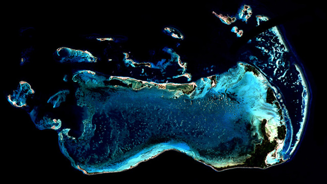 The Millennium Coral Reef Mapping project created the first ever map of coral reefs around the world using more than 1,000 coastal images obtained from the Landsat 7 satellite, such as this coral reef system in Los Roques, Venezuela. NASA/USGS