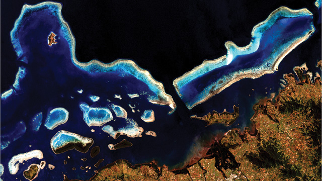 CORALS OF THE WORLD: By measuring and counting coral reefs in each 30-meter x 30-meter pixel of the more than 1,000 coastal images obtained from the Landsat 7 satellite, such as the coral reef system in Vanua Levu, Fiji pictured here, researchers estimated the total area of Earth’s coral reefs to be around 250,000 square kilometers.