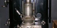 In 1933, Ernst Ruska built the first electron microscope capable of exceeding the magnification capabilities of optical microscope. The image shown here is a replica of the 1933 Ruska EM.Wikipedia, Deutsches Museum
