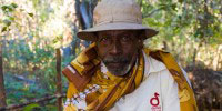 Local guardian Jaborabe and released Ploughshare Tortoise in Beaboaly, MadagascarInaki Relanzon, Durrell Wildlife Conservation Trust