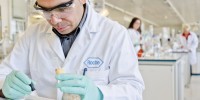 Roche ($16) researcher performing quality control of the substances in the analytical laboratory.