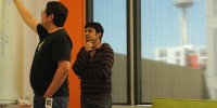 Juan Caballero, a postdoc fellow at Institute for Systems Biology (#7), talks to visiting bioinformatician Abhimanyu KrishnaInstitute for Systems Biology